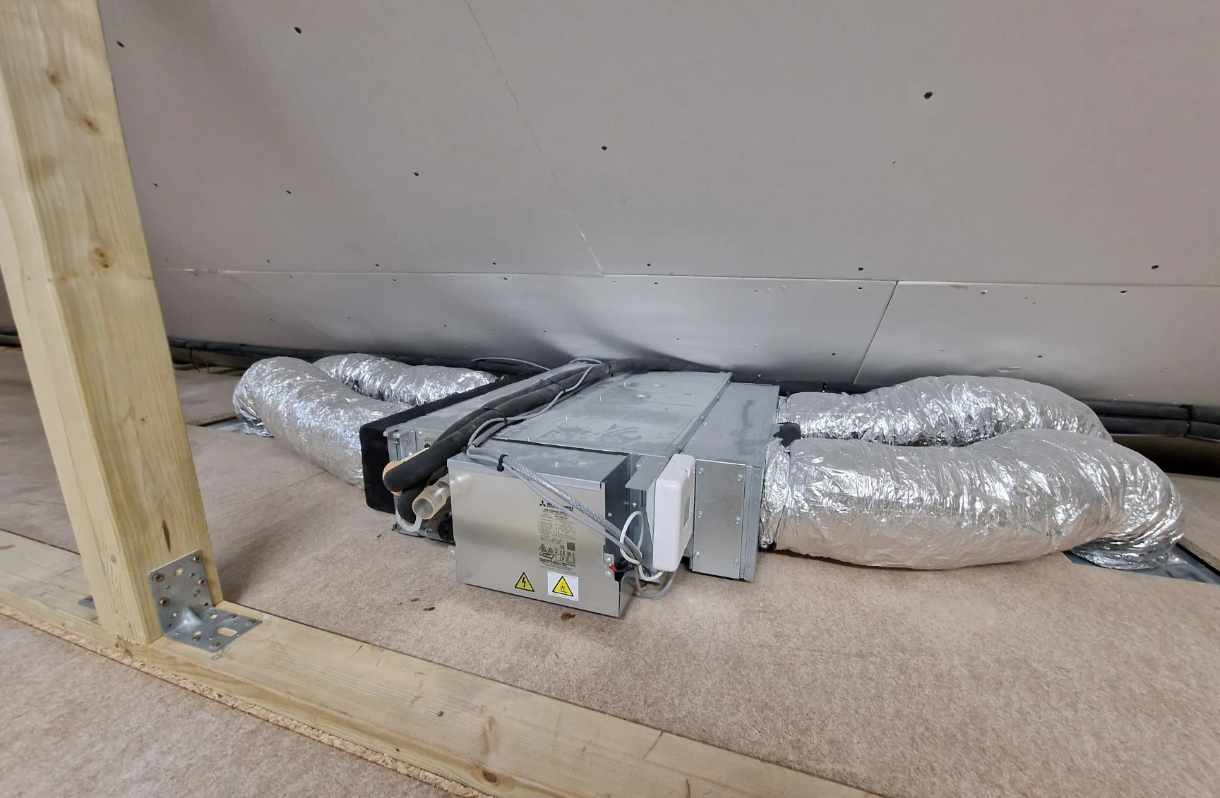 Ducted fan coil unit installation in a loft