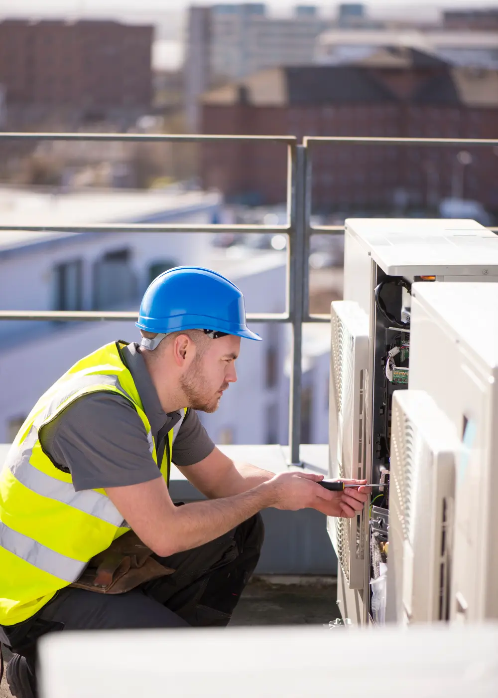 Air conditioning engineer working on an outdoor unit